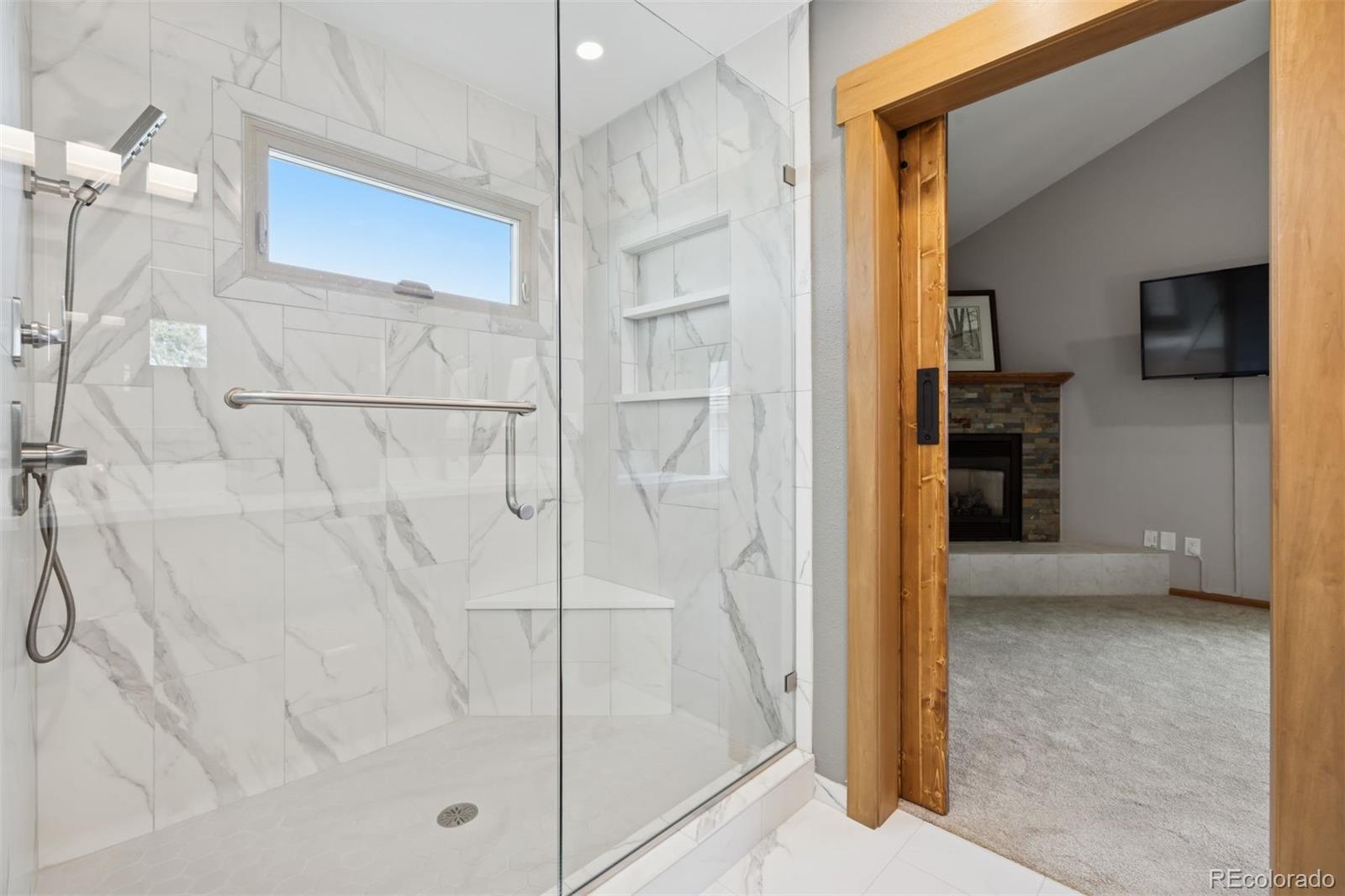 23860 Genesee Village Road Golden, CO 80401 - Photo 19 of 36 a bathroom with a shower