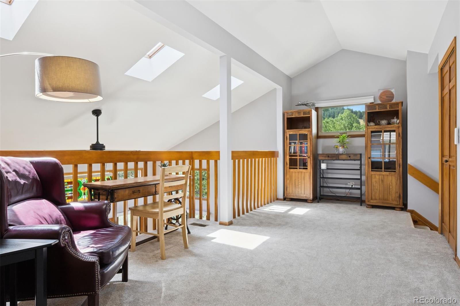 23860 Genesee Village Road Golden, CO 80401 - Photo 22 of 36 a view of a livingroom with furniture and a couch