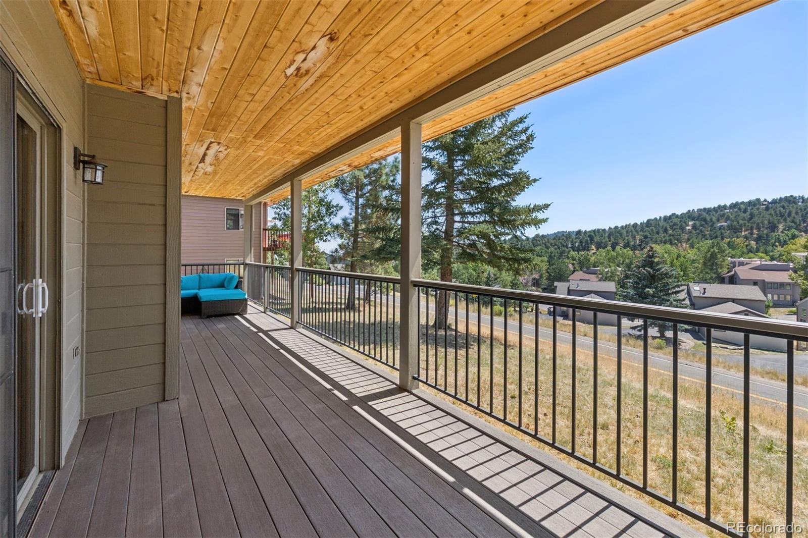 23860 Genesee Village Road Golden, CO 80401 - Photo 27 of 36 a view of balcony with wooden floor