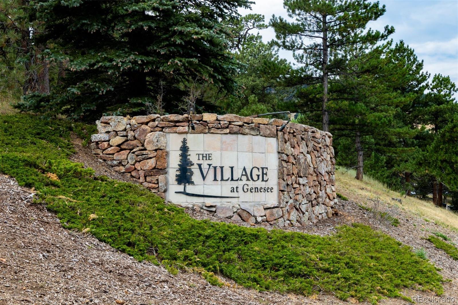 23860 Genesee Village Road Golden, CO 80401 - Photo 33 of 36 a sign on the side of the road