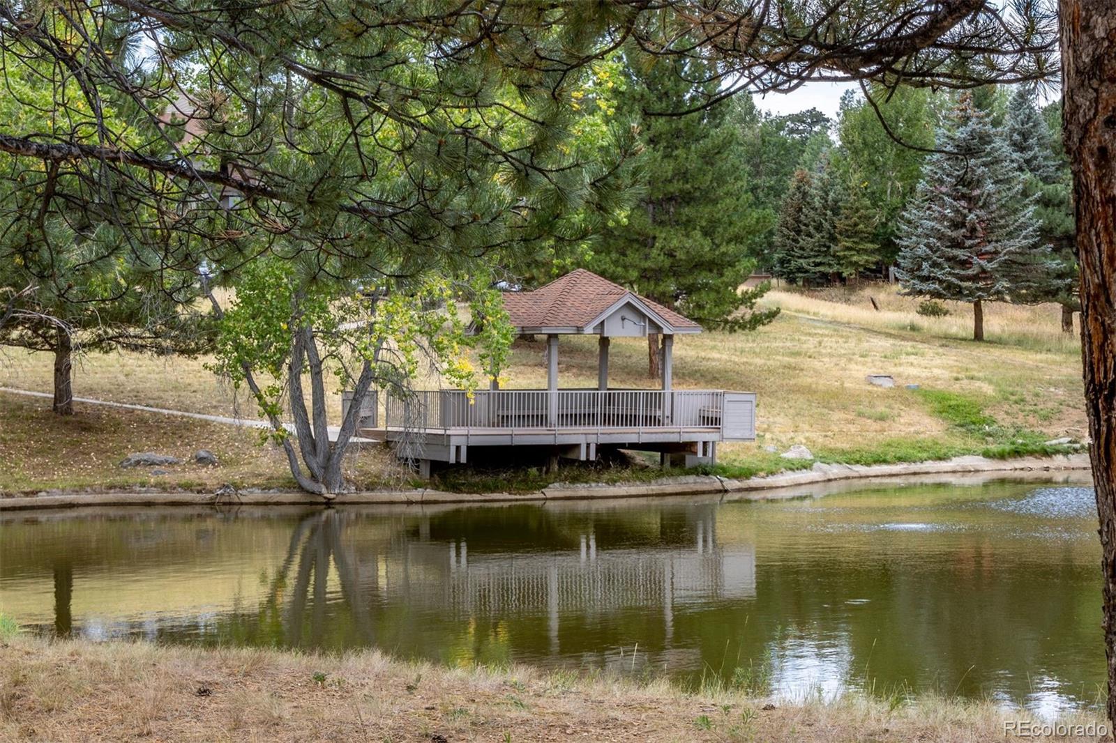 23860 Genesee Village Road Golden, CO 80401 - Photo 34 of 36 a view of house with river in front of house