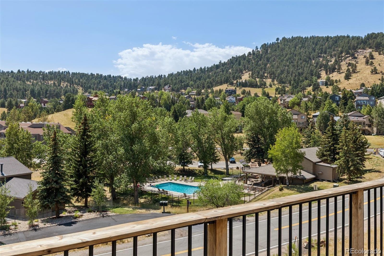 23860 Genesee Village Road Golden, CO 80401 - Photo 9 of 36 a view of a city street from a balcony