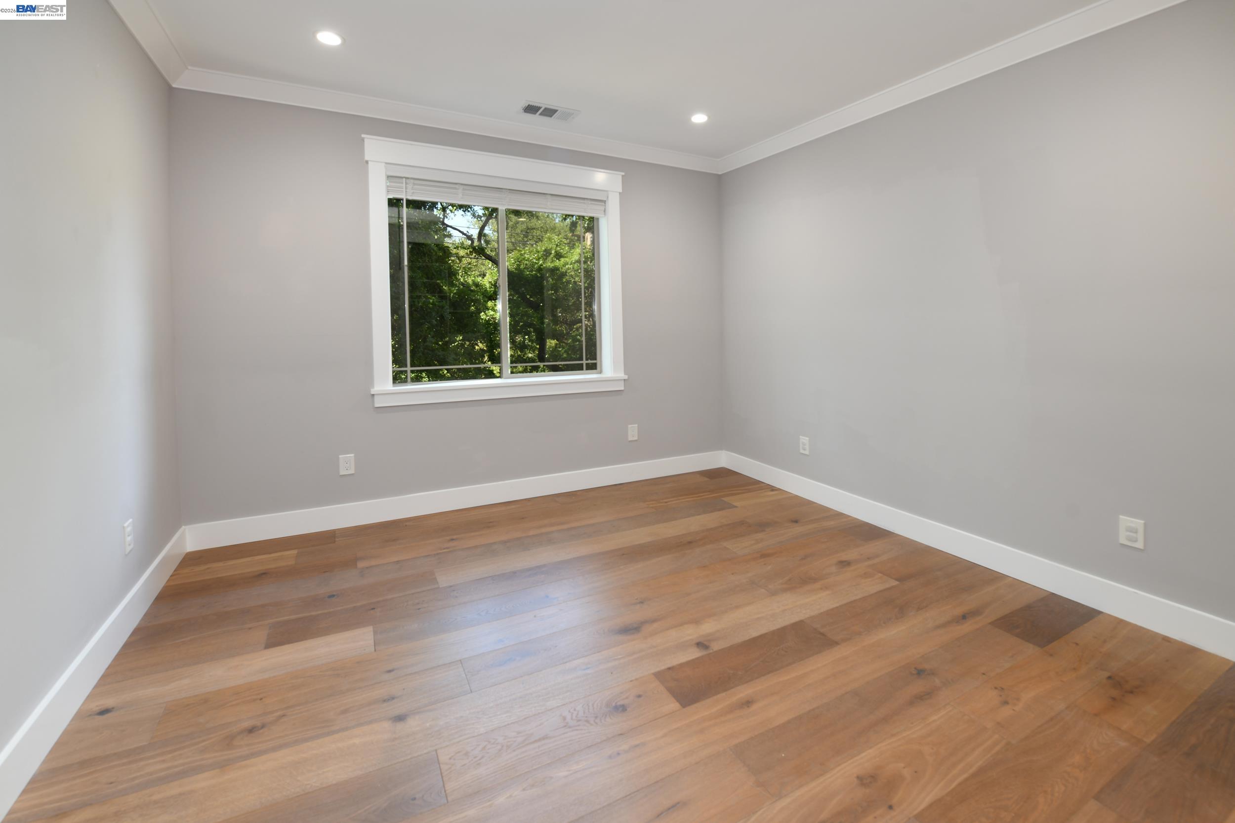 1516 Pleasant Hill Road Lafayette, CA 94549 - Photo 28 of 38 a view of an empty room with wooden floor and a window