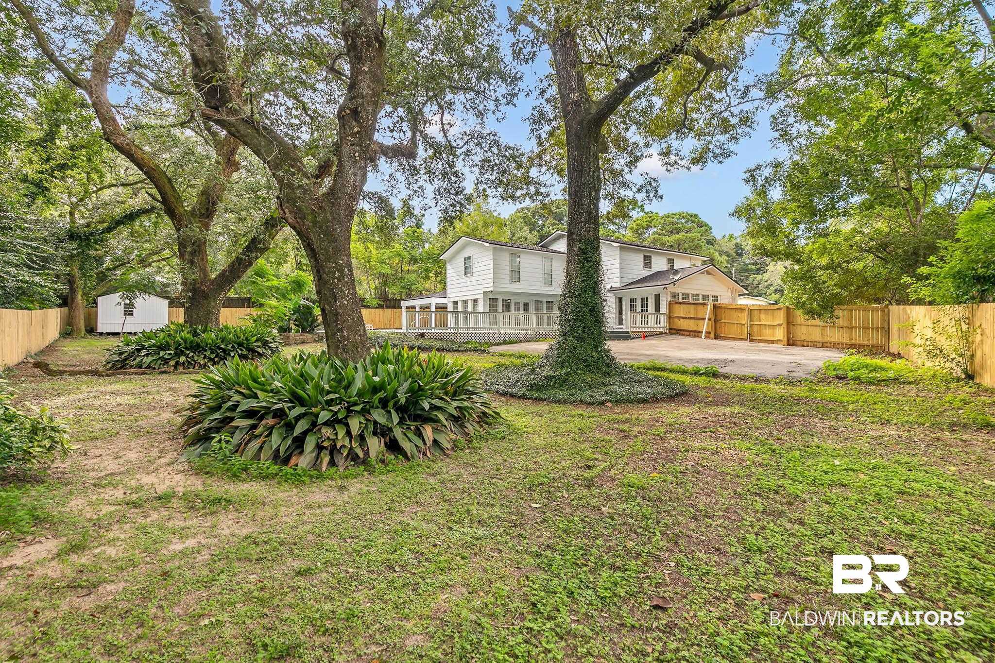 4705 Sherry Court Mobile, AL 36693 - Photo 56 of 100 Fenced backyard with a storage unit
