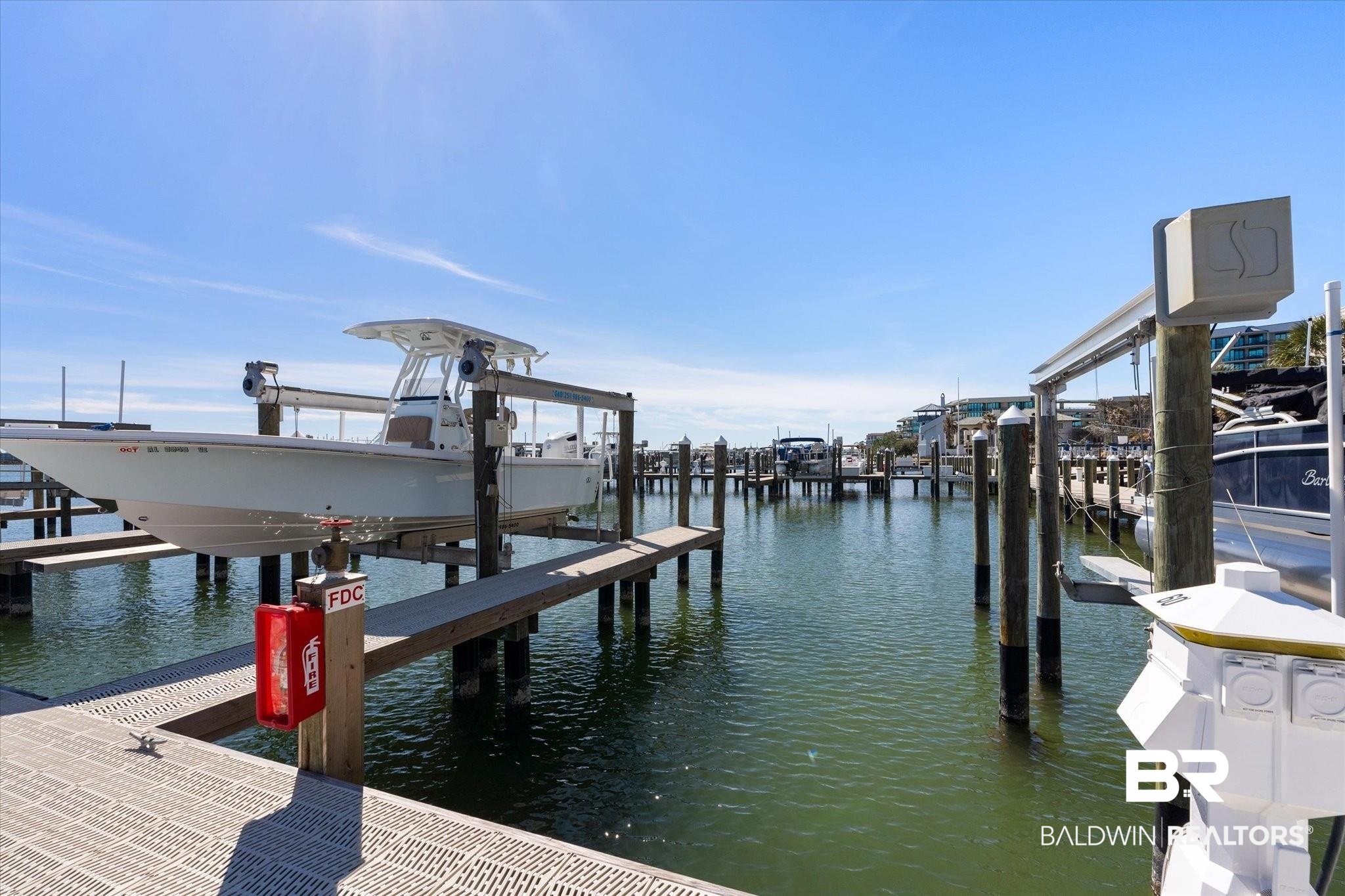 27770 Canal Road, Unit 2304 Orange Beach, AL 36561 - Photo 26 of 30 View of dock featuring a water view
