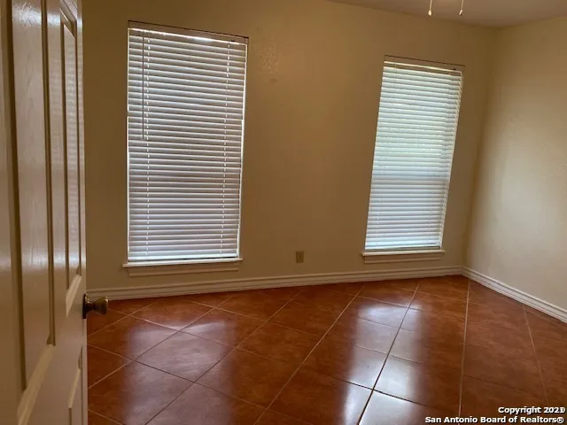 a bathroom with a sink a toilet a mirror and a tub