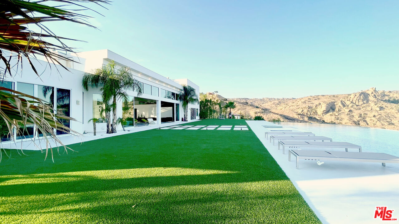 80 Saddlebow Road Bell Canyon, CA 91307 - Photo 17 of 37 a view of a house with a back yard