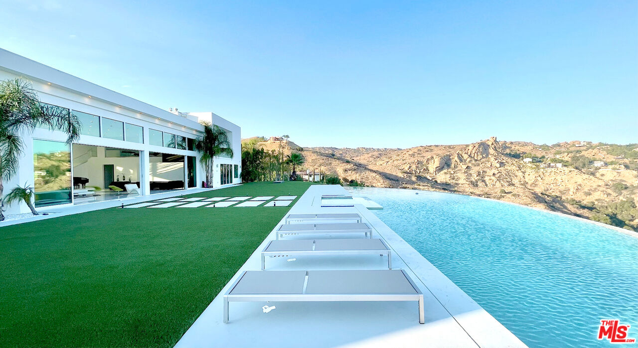 80 Saddlebow Road Bell Canyon, CA 91307 - Photo 18 of 37 a view of building with yard