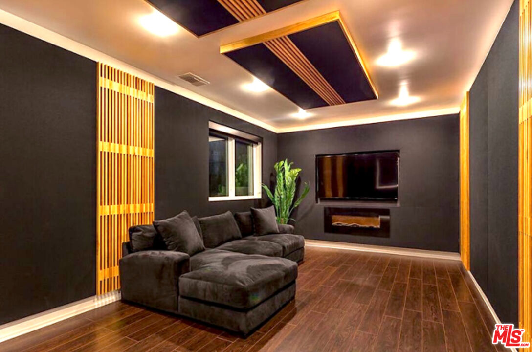 80 Saddlebow Road Bell Canyon, CA 91307 - Photo 25 of 37 a living room with furniture and a flat screen tv