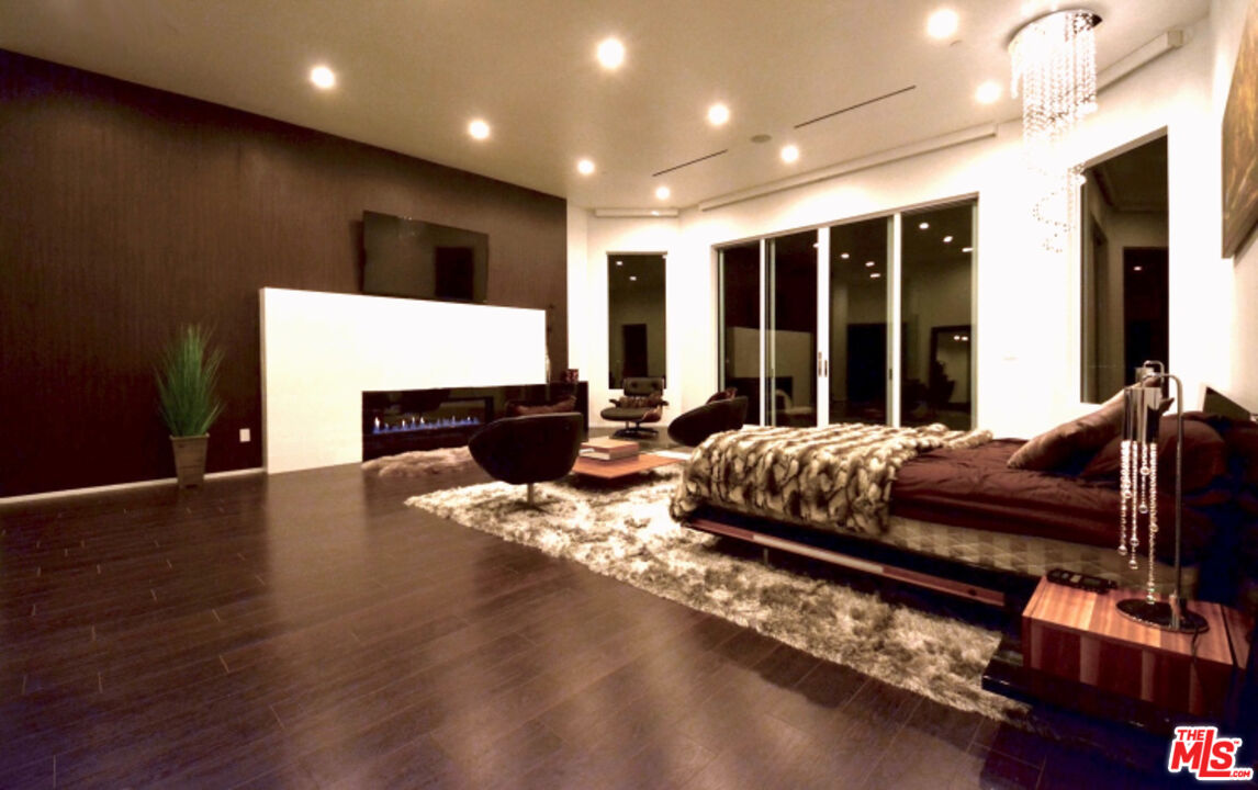 80 Saddlebow Road Bell Canyon, CA 91307 - Photo 26 of 37 a living room with furniture pool table and a flat screen tv