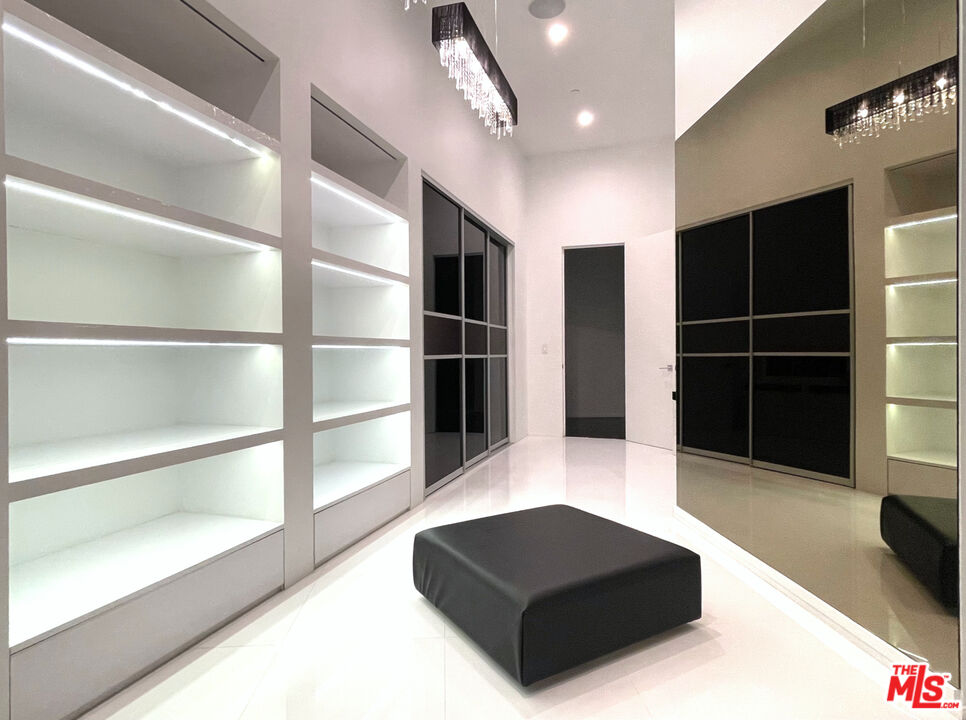 80 Saddlebow Road Bell Canyon, CA 91307 - Photo 29 of 37 a living room with furniture and a potted plant