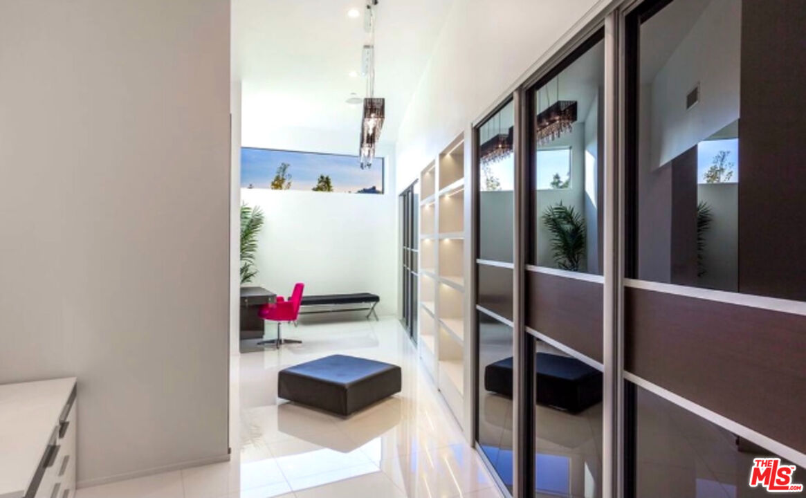 80 Saddlebow Road Bell Canyon, CA 91307 - Photo 30 of 37 a hallway with table and chairs