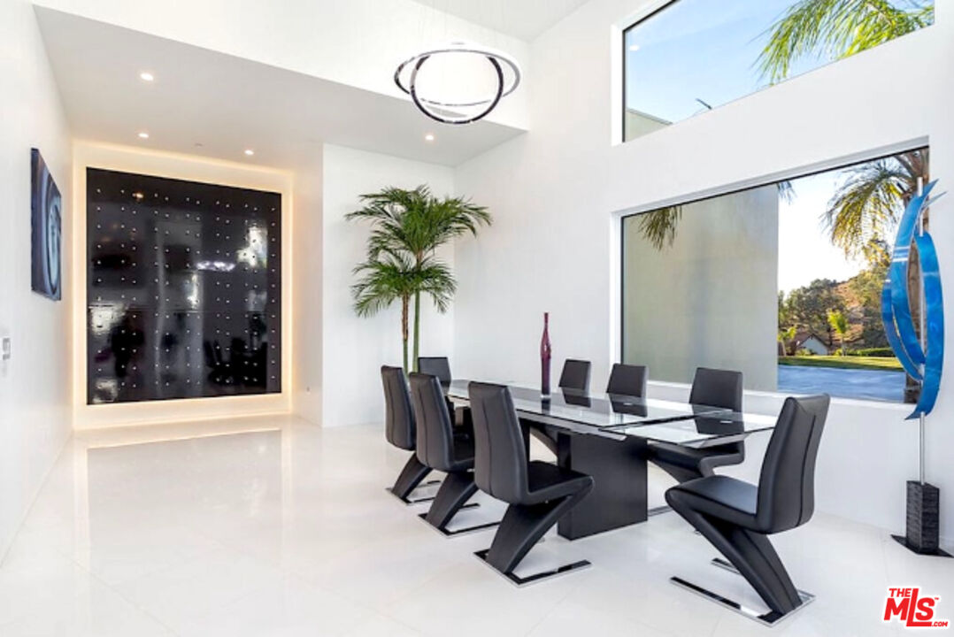 80 Saddlebow Road Bell Canyon, CA 91307 - Photo 31 of 37 a view of a livingroom with furniture and a potted plant