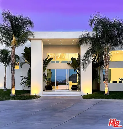 a view of a building with palm trees