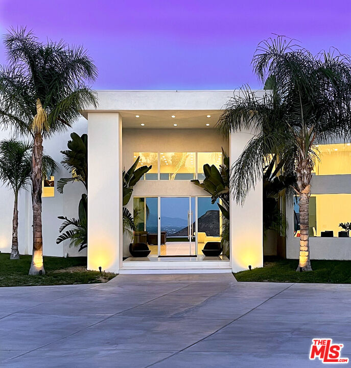 80 Saddlebow Road Bell Canyon, CA 91307 - Photo 5 of 37 a view of a building with palm trees