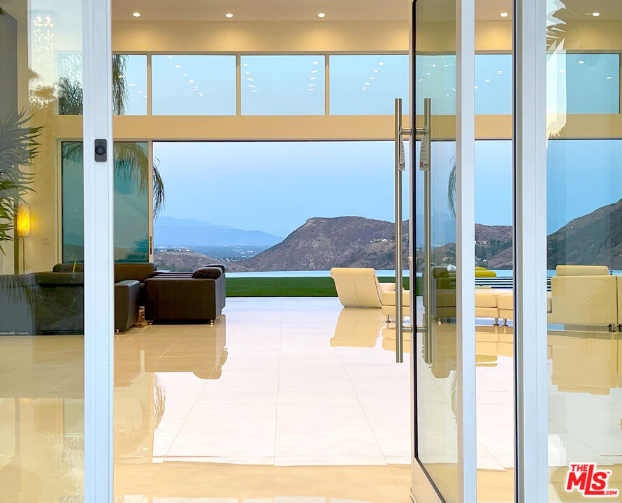80 Saddlebow Road Bell Canyon, CA 91307 - Photo 7 of 37 a view of a living room with a floor to ceiling window