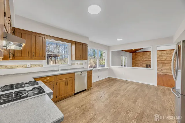 a utility room with sink dryer and washer