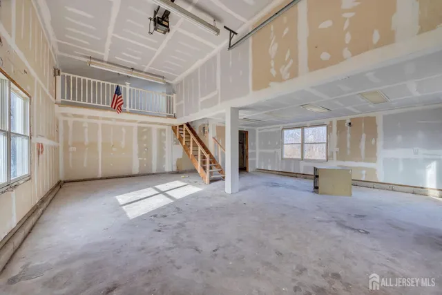 a view of a deck with wooden floor and pool with a yard