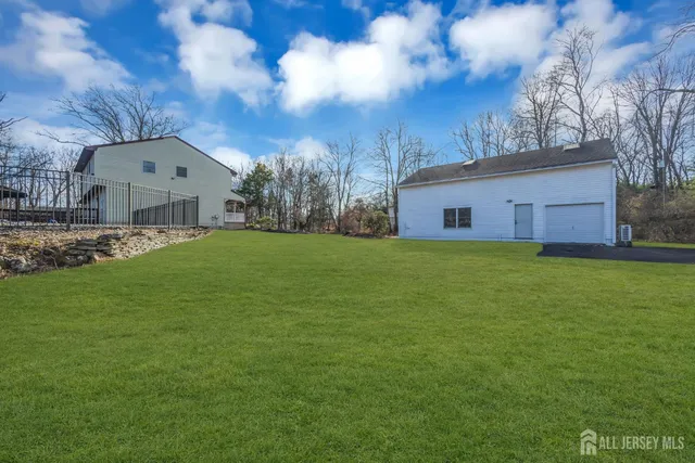 an aerial view of a house with a swimming pool