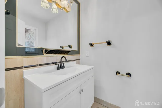 a view of empty room with wooden floor and fireplace