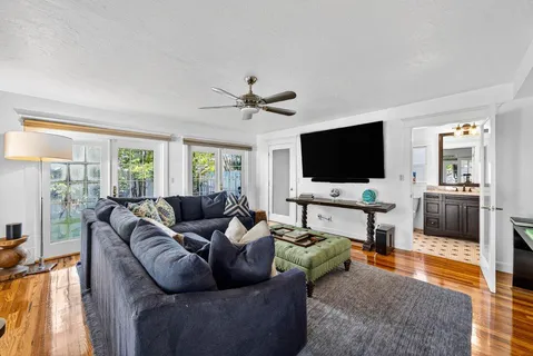 a living room with furniture and a flat screen tv
