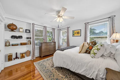 a bedroom with a bed and dresser