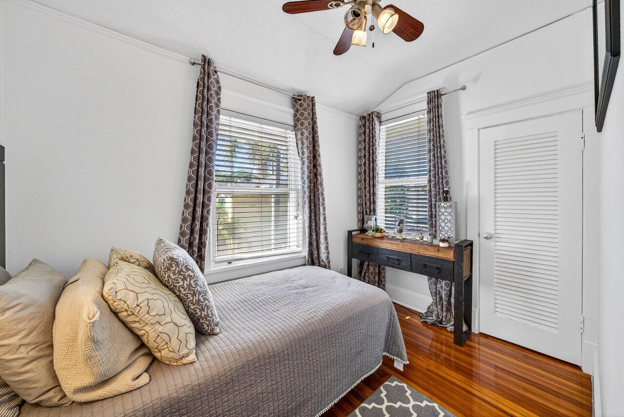 307 Wildermere Road West Palm Beach, FL 33401 - Photo 29 of 54 a bedroom with a bed and a chandelier