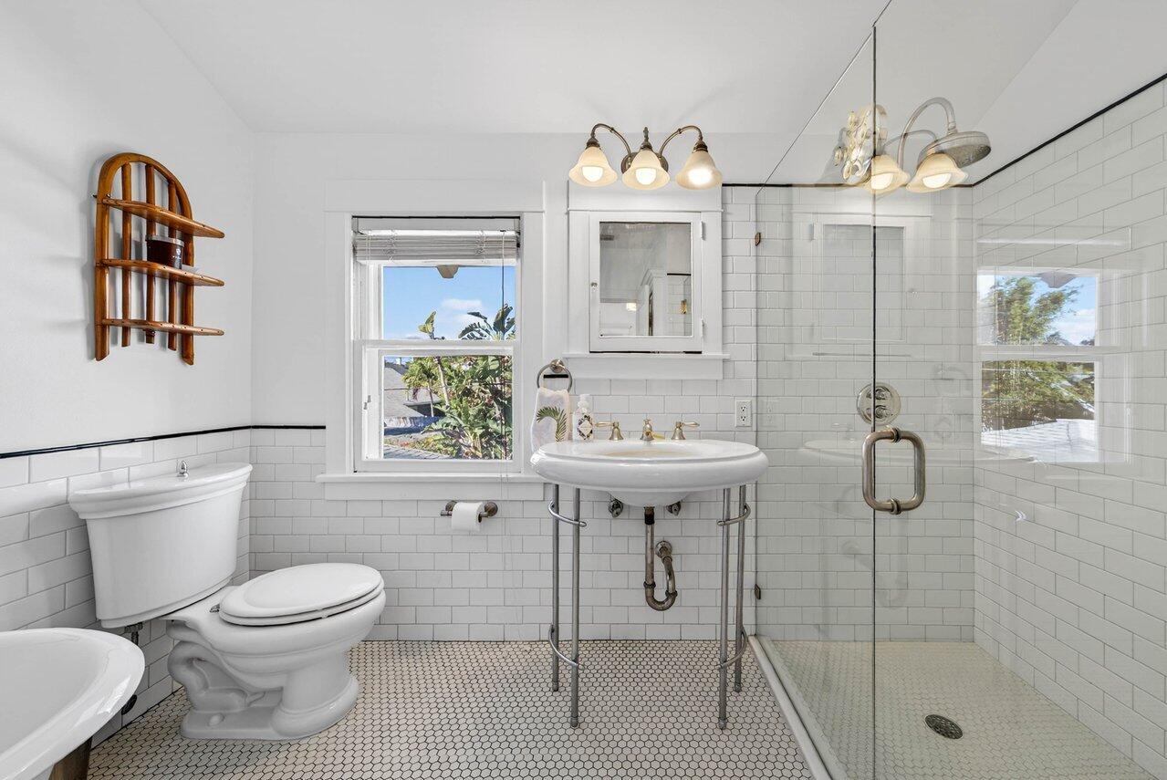 307 Wildermere Road West Palm Beach, FL 33401 - Photo 31 of 54 a bathroom with a toilet sink and mirror