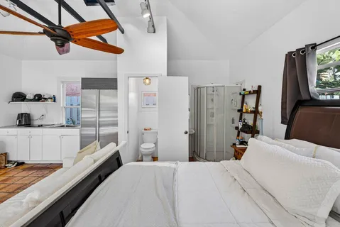 a bed room with a bed and a walk in closet