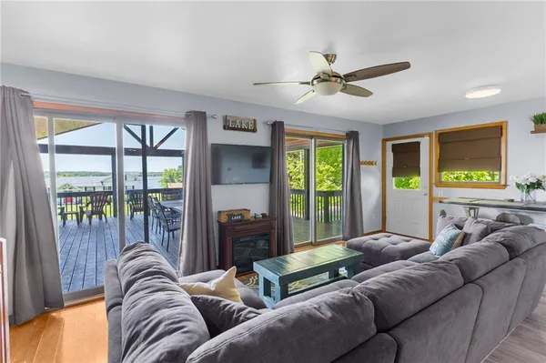 a large kitchen with lots of counter space and wooden floor
