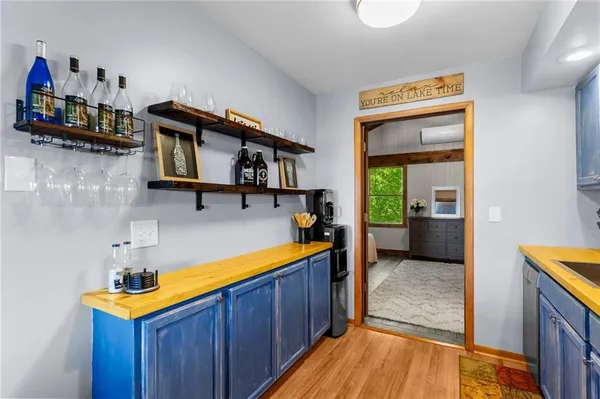 a view of a room with wooden floor and windows