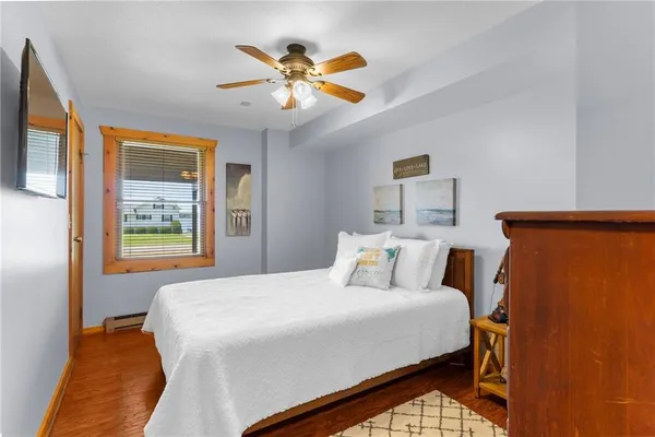 a bedroom with bed and a window