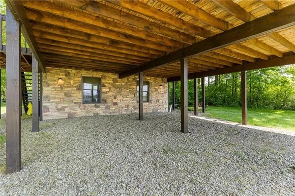 a view of a backyard with wooden floor