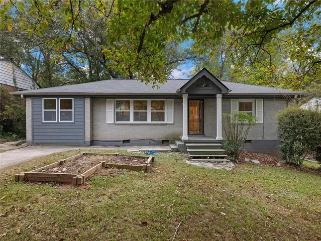 a house view with a garden space