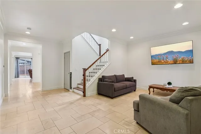 a living room with furniture and a rug