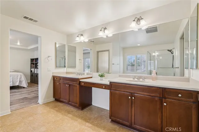 a large bathroom with a large tub and sink