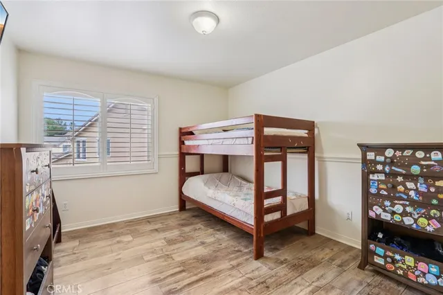 a bedroom with furniture and a window