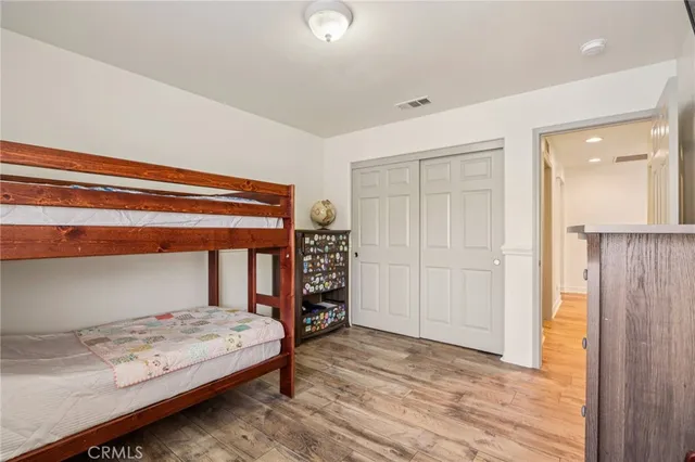 a bedroom with a bed and a closet