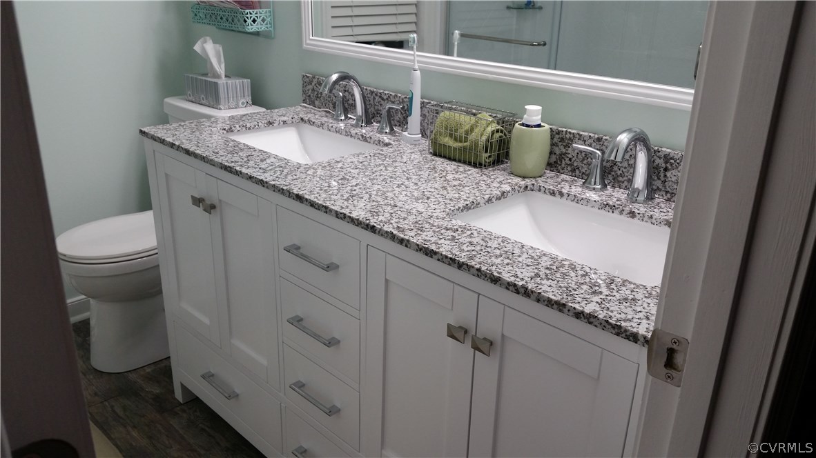 14815 Acorn Ridge Road Midlothian, VA 23112 - Photo 19 of 33 a bathroom with a granite countertop sink and a mirror