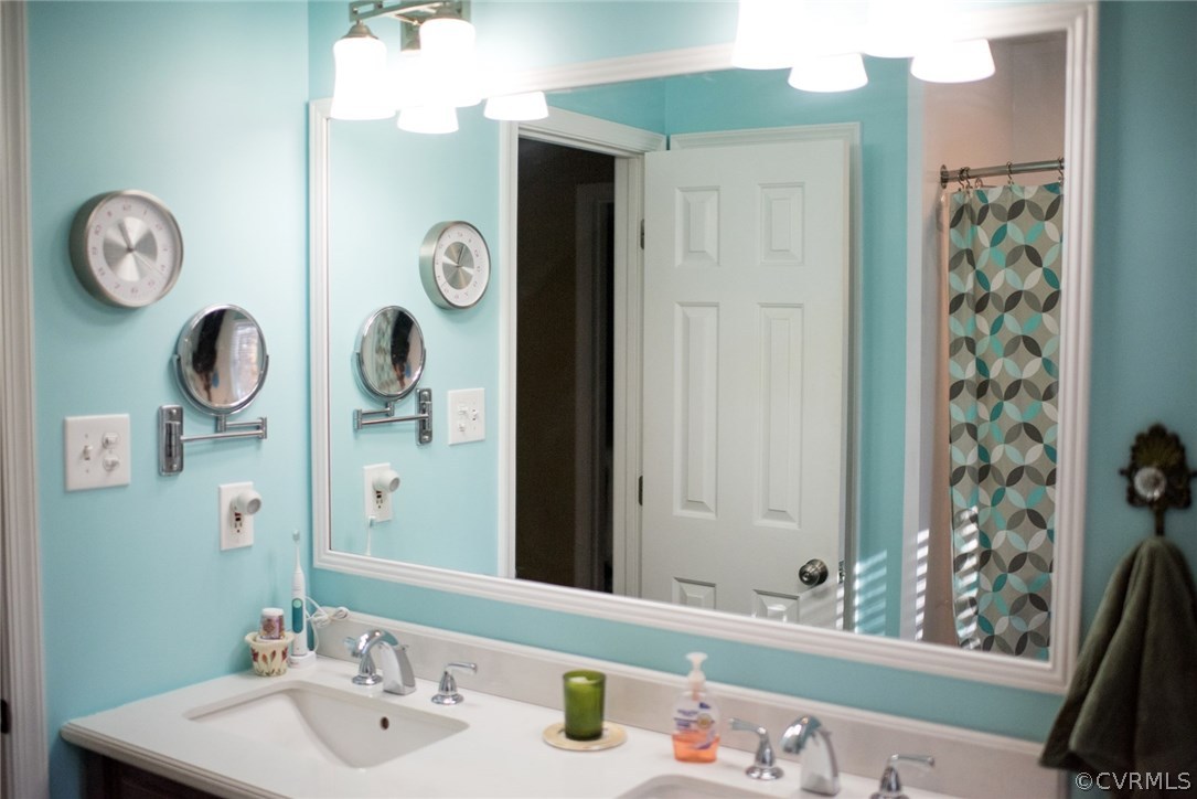14815 Acorn Ridge Road Midlothian, VA 23112 - Photo 25 of 33 a bathroom with a sink and a mirror