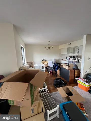 a bed room with a bed and a chair