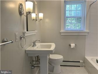 905 Rodman Road Bellefonte, DE 19809 - Photo 12 of 25 a bathroom with a sink a toilet and a mirror