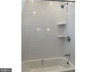 905 Rodman Road Bellefonte, DE 19809 - Photo 13 of 25 a bathroom with a bathtub