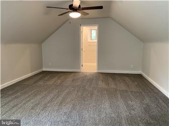 905 Rodman Road Bellefonte, DE 19809 - Photo 17 of 25 an empty room with a window and a ceiling fan