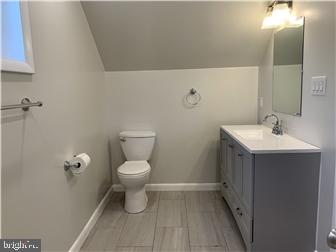905 Rodman Road Bellefonte, DE 19809 - Photo 20 of 25 a bathroom with a sink toilet and vanity
