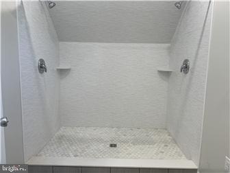 905 Rodman Road Bellefonte, DE 19809 - Photo 21 of 25 a bathroom with a shower