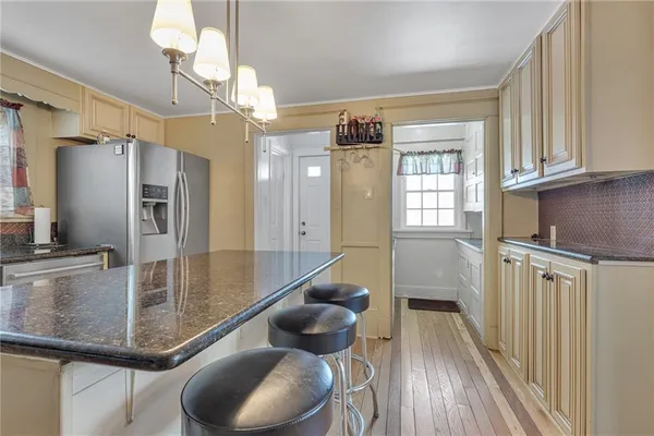 a kitchen with granite countertop white cabinets and a granite counter tops