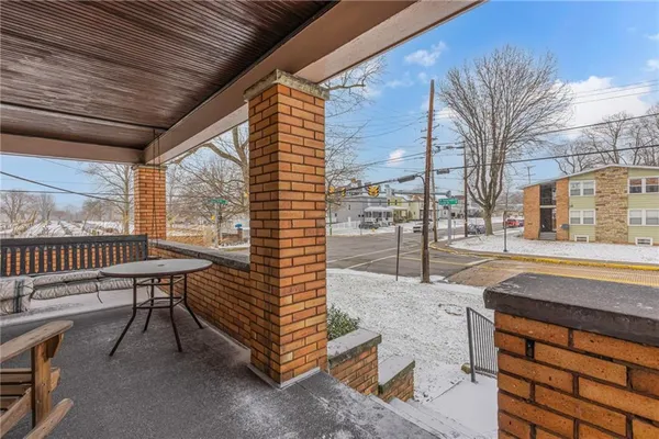 a view of a patio with a yard