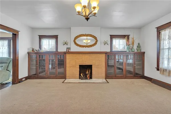 a view of a livingroom with furniture and a fireplace