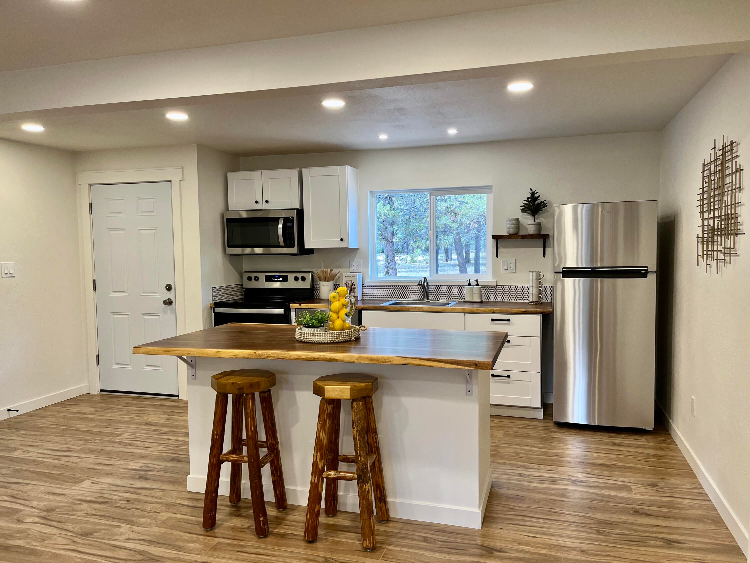 52577 River Pine Road La Pine, OR 97739 - Photo 8 of 25 Light and bright kitchen and eating island.